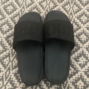 Black Nike slides